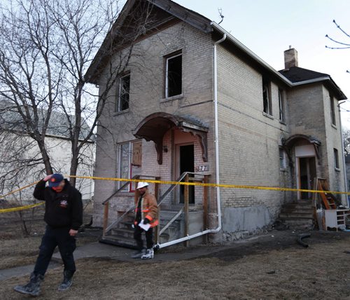 Fire Investigators at the scene of a house fire in the 300 block of Selkirk Ave. early Thursday morning. Occupants escaped without injury from the blaze that broke out aprox. 4:30A.M. Wayne Glowacki/Winnipeg Free Press April 2 2015