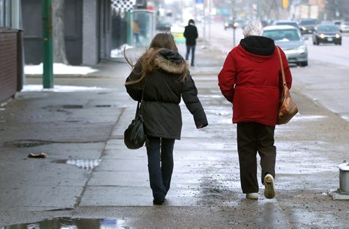 **** (left) and her mother ****walk north main to show a photograph and ask passers by of ****'s daughter **** as they search the north end for the missing 14-year-old. See Gord Sinclair's story. April2, 2015 - (Phil Hossack / Winnipeg Free Press) ***NOTE!! WE CANNOT ID ANY OF THESE WOMEN AT THIS POINT. THE PHOTOS HERE WITH FACES SHOWING ARE TO BE USED ONLY WITH AUTHORIZATION FROM MIKE APORIOUS.***
