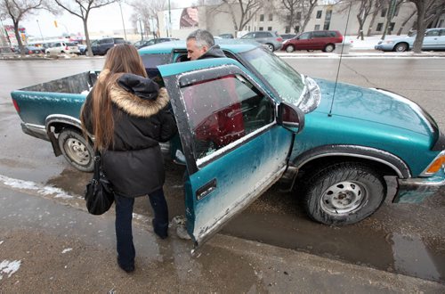 **** (left) stops a stranger getting out of his truck as she walks north main to show a photograph and ask passers by if they've seen her daughter **** as she searches the north end for her missing 14-year-old. See Gord Sinclair's story. April2, 2015 - (Phil Hossack / Winnipeg Free Press) ***NOTE!! WE CANNOT ID ANY OF THESE WOMEN AT THIS POINT. THE PHOTOS HERE WITH FACES SHOWING ARE TO BE USED ONLY WITH AUTHORIZATION FROM MIKE APORIOUS.***