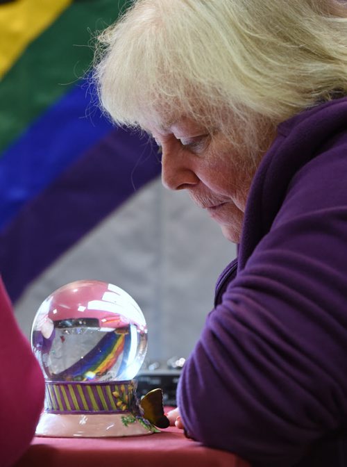 DAVID LIPNOWSKI / WINNIPEG FREE PRESS  Professional psychic Ginger Ella reads a crystal ball at a psychic fair at Canad Inns, Regent Ave Friday April 3, 2015. The fair goes all weekend.