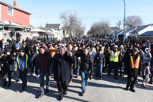 DAVID LIPNOWSKI / WINNIPEG FREE PRESS  Archbishop Richard Gagnon leads the Way of the Cross from St. Edward the Confessor Church Friday April 3, 2015. The procession included about 1,000 worshippers that walked a 1.5km route that stopped for readings and prayer.