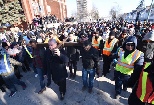 DAVID LIPNOWSKI / WINNIPEG FREE PRESS  Archbishop Richard Gagnon leads the Way of the Cross from St. Edward the Confessor Church Friday April 3, 2015. The procession included about 1,000 worshippers that walked a 1.5km route that stopped for readings and prayer.