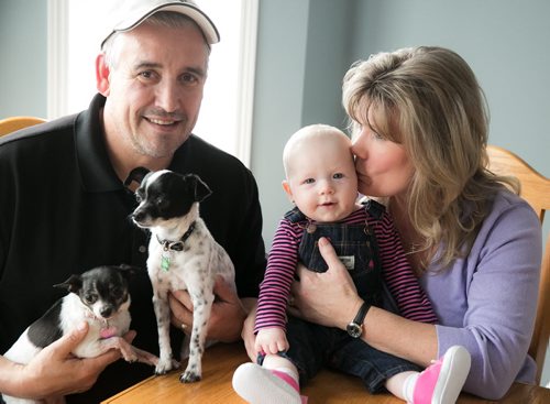 MP Shelly Glover with her husband Bruce, Shelly's six-month-old grandchild Mila and their two dogs. Glover announced April 3rd that she would not seek reelection as MP for St. Boniface in the next federal election.   150403 - Friday, April 03, 2015 - (Melissa Tait / Winnipeg Free Press)
