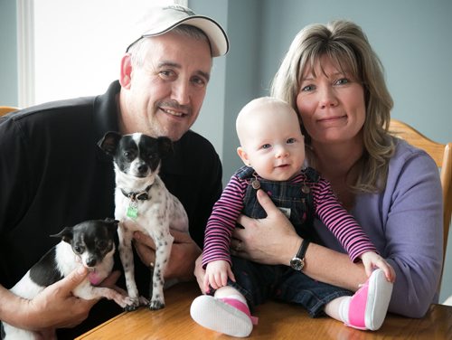 MP Shelly Glover with her husband Bruce, Shelly's six-month-old grandchild Mila and their two dogs. Glover announced April 3rd that she would not seek reelection as MP for St. Boniface in the next federal election.   150403 - Friday, April 03, 2015 - (Melissa Tait / Winnipeg Free Press)