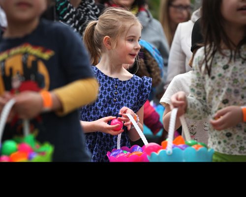 Kids are all smiles as they wait in line to exchange their coloured eggs for chocolate and candies at Shemerdine's first Easter Egg Hunt  event Saturday morning.   Standup photo.    April 4, 2015 Ruth Bonneville / Winnipeg Free Press.