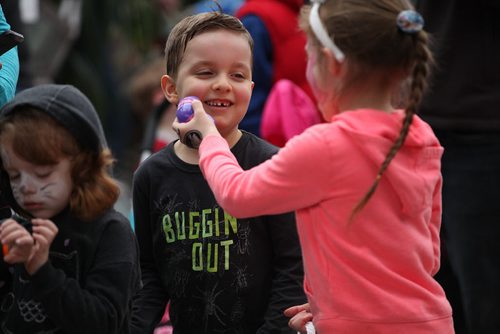 Five-year- old Jayden Borges is all smiles he waits in line to exchange his  coloured eggs that he found during his hunt for chocolate and candies at Shemerdine's first Easter Egg Hunt  event Saturday morning.   Standup photo.    April 4, 2015 Ruth Bonneville / Winnipeg Free Press.