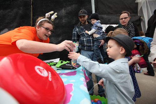Three-year-old Ashton Criggar exchanges his coloured eggs for chocolate and candies at Shemerdine's first Easter Egg Hunt  event Saturday morning.   Standup photo.    April 4, 2015 Ruth Bonneville / Winnipeg Free Press.