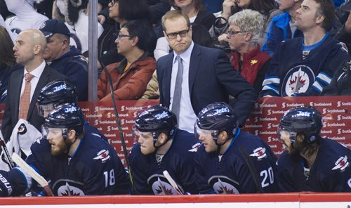 150404 Winnipeg - DAVID LIPNOWSKI / WINNIPEG FREE PRESS  The Winnipeg Jets bench and coach Paul Maurice during third period action against the Vancouver Canucks Saturday April 4, 2015 at the MTS Centre.