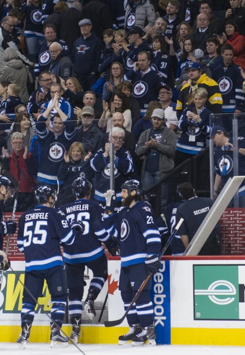 150404 Winnipeg - DAVID LIPNOWSKI / WINNIPEG FREE PRESS  The Winnipeg Jets following their win over the Vancouver Canucks Saturday April 4, 2015 at the MTS Centre.