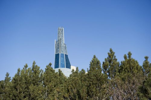 150405 Winnipeg - DAVID LIPNOWSKI / WINNIPEG FREE PRESS  The Canadian Museum for Human Rights peeks out from some trees Sunday April 5, 2015.