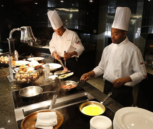 Restaurant Review. The breakfast buffet the Fort Garry Hotel. Chefs Dennis Richard, right, and Nicholas Rose prepare orders. Marion Warhaft story Wayne Glowacki/Winnipeg Free Press April 6 2015