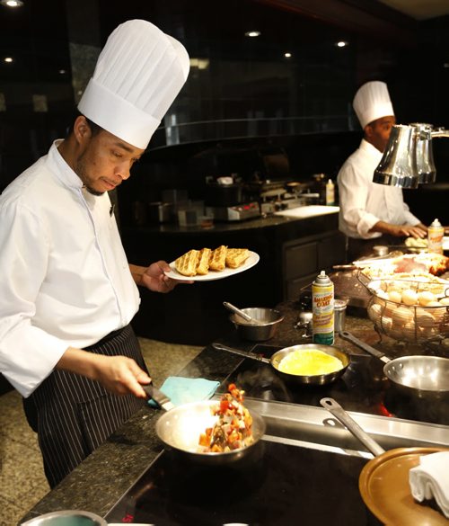 Restaurant Review. The breakfast buffet the Fort Garry Hotel. Chefs Nicholas Rose,left, and Dennis Richard prepare orders. Marion Warhaft story Wayne Glowacki/Winnipeg Free Press April 6 2015