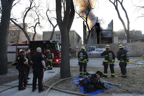 April 6, 2015 - 150406  -  Fire crews work on extinguishing a fire at the empty building next to 42 Hargrave Monday, April 6, 2015. John Woods / Winnipeg Free Press