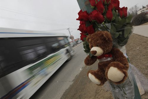 April 7, 2015 - 150407  -  Amemorial at the corner of Burrows and Keewatin for a woman who was killed after she was hit by a bus driver in a city bus Tuesday, April 7, 2015. John Woods / Winnipeg Free Press