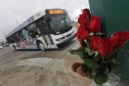 April 7, 2015 - 150407  -  A memorial at the corner of Burrows and Keewatin for a woman who was killed after she was hit by a bus driver in a city bus Tuesday, April 7, 2015. John Woods / Winnipeg Free Press