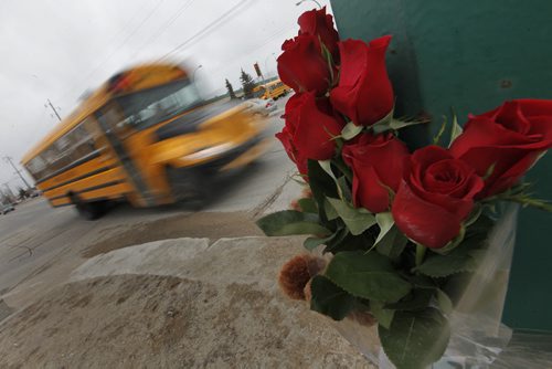 April 7, 2015 - 150407  -  Amemorial at the corner of Burrows and Keewatin for a woman who was killed after she was hit by a bus driver in a city bus Tuesday, April 7, 2015. John Woods / Winnipeg Free Press