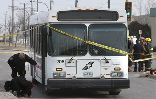 Winnipeg Police at the scene where an elderly woman was killed Tuesday morning after being struck by a city bus at the corner of Keewatin Street and Burrows Avenue. Jenna Dulewich story.Wayne Glowacki/Winnipeg Free Press April 7 2015