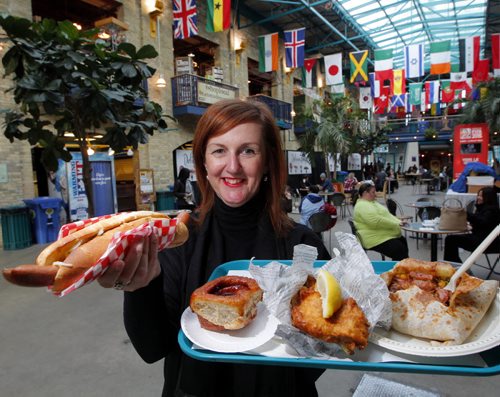 LOCAL-NEW FORKS FOOD RENO- Clare MacKay, Vice-President, (Corporate & Community Initiatives The Forks North Portage) poses with some yummy food from the Forks food courts. Story about upcoming improvements. BORIS MINKEVICH/WINNIPEG FREE PRESS APRIL 8, 2015
