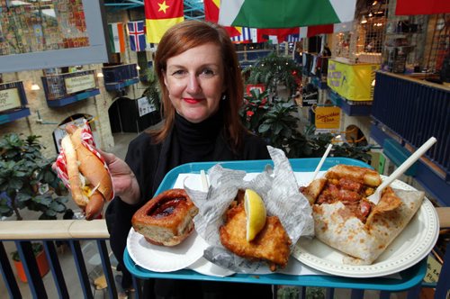 LOCAL-NEW FORKS FOOD RENO- Clare MacKay, Vice-President, (Corporate & Community Initiatives The Forks North Portage) poses with some yummy food from the Forks food courts. Story about upcoming improvements. BORIS MINKEVICH/WINNIPEG FREE PRESS APRIL 8, 2015