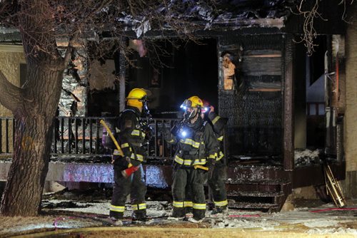 LOCAL - Fire on Ross Ave. W. Fire crews clear up after a house was destroyed by fire. A police matter was also at the same address. BORIS MINKEVICH/WINNIPEG FREE PRESS APRIL 8, 2015