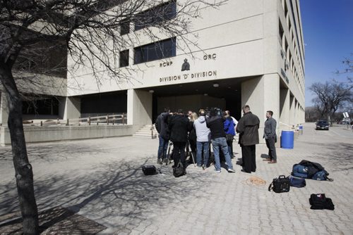 Assistant Commissioner Kevin Brosseau, Commanding Officer (uniform) and Glen Lewis, Executive Director of Policing answer questions from the media outside the RCMP building in Winnipeg Thursday afternoon about suspicious packages sent to MB courts. See Ales Paul story.  April 9, 2015 Ruth Bonneville / Winnipeg Free Press.