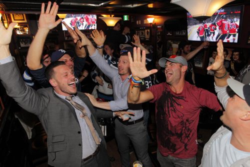 LOCAL/SPORTS - Winnipeg Jets fans are in the playoffs. Here they celebrate at The Pint. BORIS MINKEVICH/WINNIPEG FREE PRESS APRIL 9, 2015