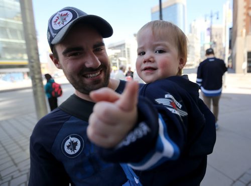 Kazwel Levandoski and his son, Zaiden, 13 months, for Bill Redekop Streeter at Winnipeg Jets game, Saturday, April 11, 2015. (TREVOR HAGAN/WINNIPEG FREE PRESS)