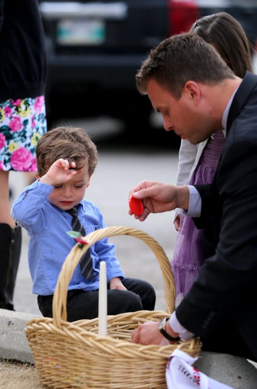 Ken Azaransky with his children Kyle, 2, and Alison,4, preparing an Easter Basket, to be blessed by Metropolitan Archbishop of Winnipeg, Yurij, as he leads Pascha service at Holy Trinity Ukrainian Orthodox Cathedral, Sunday, April 12, 2015. (TREVOR HAGAN/WINNIPEG FREE PRESS)