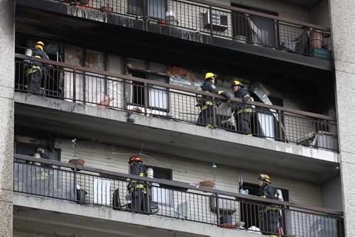 April 12, 2015 - 150412  -  Firefighters attend a fire on an apartment balcony at 429 Westwood Sunday, April 12, 2015. John Woods / Winnipeg Free Press