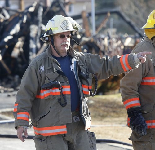 St. Andrews Fire Chief Ken Peacock at the scene of a house fire on  Schreyer Crescent Monday morning.  Nick Martin  story Wayne Glowacki/Winnipeg Free Press April 13 2015