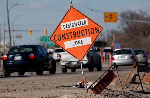 Traffic is sqeezed to one lane on north bound main street near the perimeter by construction Monday afternoon. See story. April 13, 2015 - (Phil Hossack / Winnipeg Free Press)
