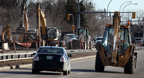 Traffic is sqeezed to one lane on north bound main street near the perimeter by construction Monday afternoon. See story. April 13, 2015 - (Phil Hossack / Winnipeg Free Press)