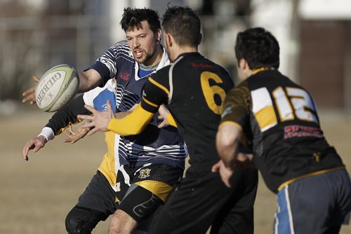 April 13, 2015 - 150413  -  Thomas Pharazyn, fullback, and the Winnipeg Wasps practise at River Heights Community Centre Monday, April 13, 2015. The team is practising for a rugby tour of  Ireland at the end of April. John Woods / Winnipeg Free Press