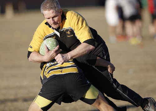 April 13, 2015 - 150413  -  Ron Enberg, flanker, and the Winnipeg Wasps practise at River Heights Community Centre Monday, April 13, 2015. The team is practising for a rugby tour of  Ireland at the end of April. John Woods / Winnipeg Free Press