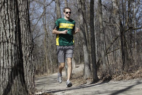 David Richert, a race car driver driving in Europe's Formula Renault 2.0 series keeps fit by running in nearby park Bois-des-esprits.   Ruth Bonneville / Winnipeg Free Press April 14, 2015