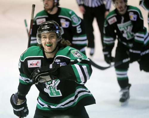 Portage Terriers #19 Carson Perreaux skates back to the bench to celebrate his go ahead and winning goal as the Terriers prevailed 4-3 over the Steinbach Pistons Tuesday evening in Steinbach. See Melissa Martin's story. April 14, 2015 - (Phil Hossack / Winnipeg Free Press)