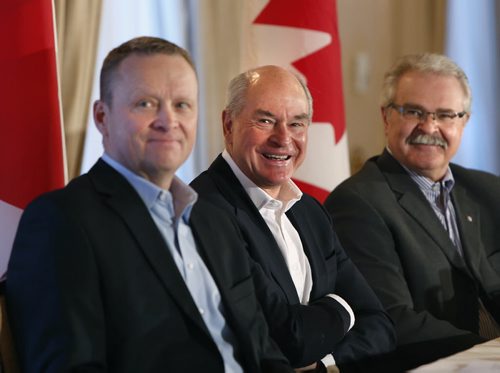 From right, Agriculture Minister Gerry Ritz, Ian White pres. and CEO CWB and Karl Gerrand, pres. and CEO G3 watch a video at the  news conference in Winnipeg Wednesday to give an update on the commercialization process for CWB.  Martin Cash story Wayne Glowacki/Winnipeg Free Press April 15 2015