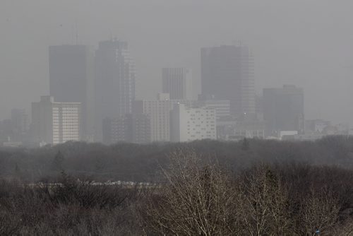 Downtown Winnipeg can barely be seen  from Westview Park (Garbage hill) Wednesday afternoon due to the high winds kicking up dust and smoke from nearby brush fires.  
Standup photo. 

 Ruth Bonneville / Winnipeg Free Press
April 15, 2015
