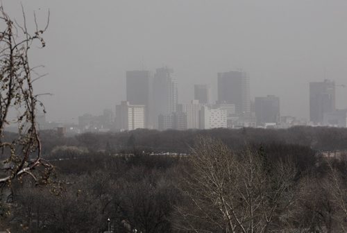 Downtown Winnipeg can barely be seen  from Westview Park (Garbage hill) Wednesday afternoon due to the high winds kicking up dust and smoke from nearby brush fires.  
Standup photo. 

 Ruth Bonneville / Winnipeg Free Press
April 15, 2015