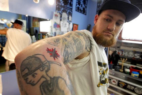 JETS TATTOO - South of Heaven Tattoo artist Karen Melia(not in photo) put a Winnipeg Jets tattoo on Lawrence Lavallee, pictured here.  BORIS MINKEVICH/WINNIPEG FREE PRESS APRIL 15, 2015
