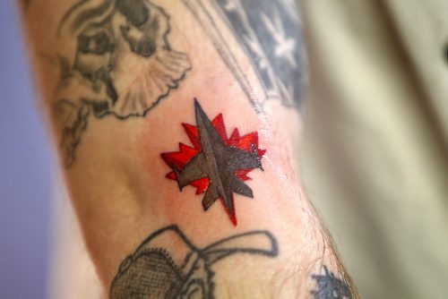 JETS TATTOO - South of Heaven Tattoo artist Karen Melia puts a Winnipeg Jets tattoo on Lawrence Lavallee.  Close up of tattoo. BORIS MINKEVICH/WINNIPEG FREE PRESS APRIL 15, 2015