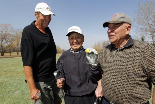 LOCAL FITNESS - A fellow named Frank Yahiro at the Rossmere Golf Course driving range. He's 91, has had 7 hole-in-ones in his golf career. Here he is flanked by his friends John Taylor and Walter Galagan. (left and right) BORIS MINKEVICH/WINNIPEG FREE PRESS APRIL 15, 2015