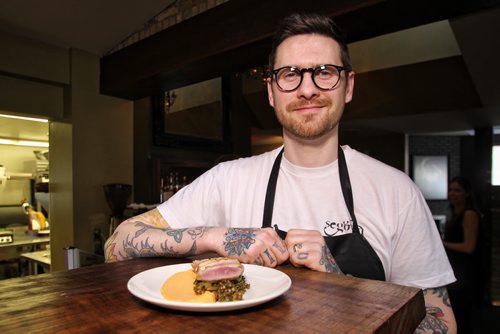 Adam Donnelly chef and owner of Segovia restaurant on Stradbrook prepares a plate of the seared duck breast on lentils.  150415 April 15, 2015 Mike Deal / Winnipeg Free Press