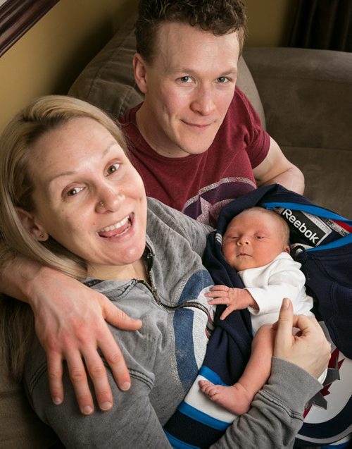 Justine and Jeremy Welwood with their two-day-old baby boy Jett. He's not just named after the Winnipeg Jets, the parents both liked the name - for a boy or a girl. Born April 13th, 2015, just a few days before the Winnipeg Jets start their first playoff run since 1996. 150415 - Wednesday, April 15, 2015 - (Melissa Tait / Winnipeg Free Press)