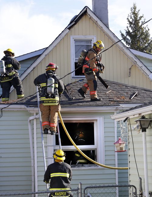 Winnipeg Fire Fighters at the scene of a house fire in the 100 block of Royal Ave. Thursday morning. No one was home when the fire broke out in the back of the house in the kitchen area. Two cats died in the fire. The cause of the fire is under investigation and a damage estimate was not available.Wayne Glowacki/Winnipeg Free Press April 16  2015