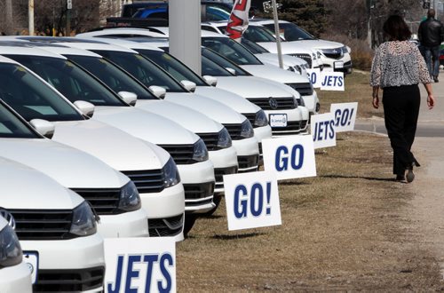 Whiteout on Century-  St. James Volkswagen Audi used some creative advertising lining up 20 white cars for sale with Go Jets Go signs on their lot on Century St Thursday- standup photo- Apr 16, 2015   (JOE BRYKSA / WINNIPEG FREE PRESS)