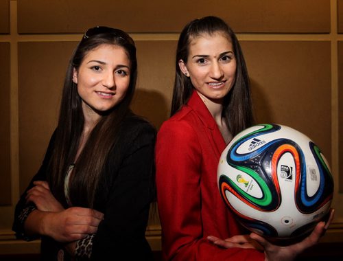 Sisters, Zainab Hilo (left), 16, and Nazdar Hilo, 18, who came to Winnipeg as refugees from Iraq in 2010 have been chosen to be FIFA flag bearers at the Womens World Cup here this summer. 150416 April 16, 2015 Mike Deal / Winnipeg Free Press