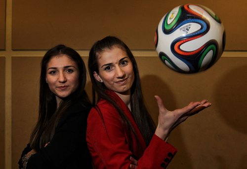 Sisters, Zainab Hilo (left), 16, and Nazdar Hilo, 18, who came to Winnipeg as refugees from Iraq in 2010 have been chosen to be FIFA flag bearers at the Womens World Cup here this summer. 150416 April 16, 2015 Mike Deal / Winnipeg Free Press