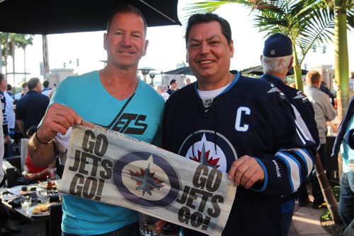 Kim Koswin and Mike Kostiuk pose for a picture in sunny Anaheim, something he promised he'd seen in person if the Jets ever made the playoffs.