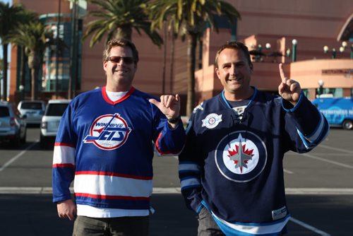 Brothers Nelson and Paul Maurer pose out front the Honda Center.